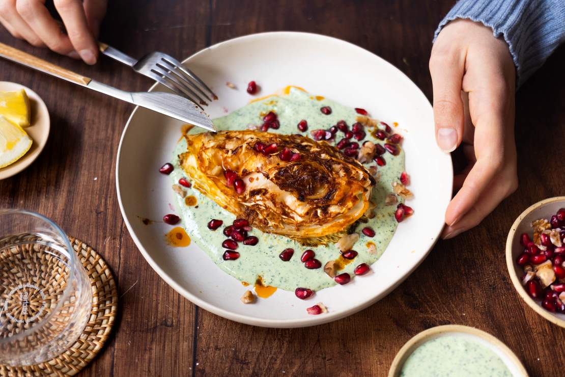 R884 Baked pointed cabbage with herb yogurt and walnut-pomegranate topping
